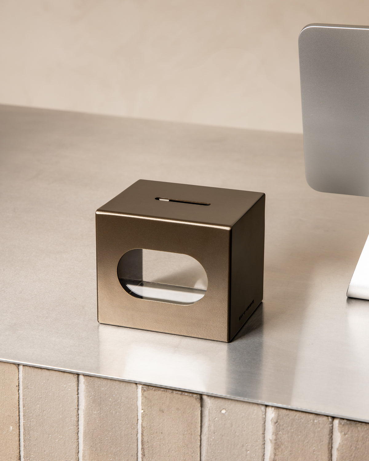 Bronze FOLD Tip Box on a countertop with the magnetic header removed