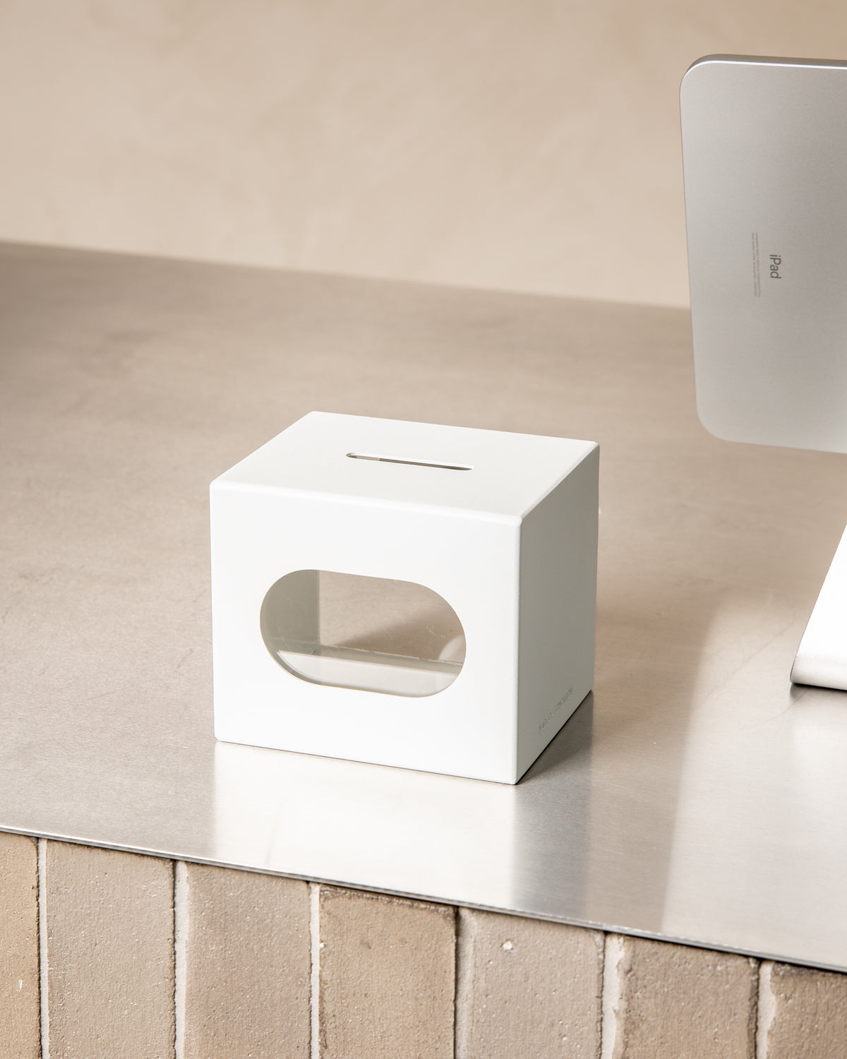 White FOLD Tip Box on a countertop with the magnetic header removed